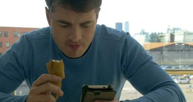 Man with Smartphone and Ice-Cream video