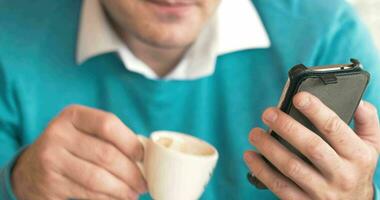 Man using cell phone and making notes video