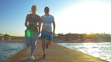 Couple Jogging on the Sea Pier video
