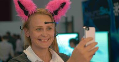 Woman with neuro ears making selfie video