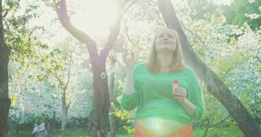 Pregnant Woman Blowing Soap Bubbles video