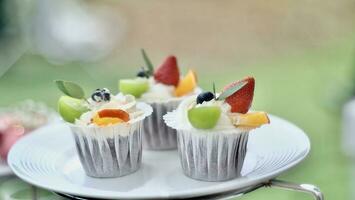 cupcakes with fresh cream and fresh fruit in wedding event photo