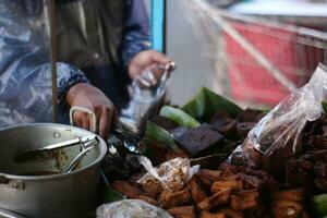 various side dishes, namely tempeh and bacem tofu at roadside sellers. photo