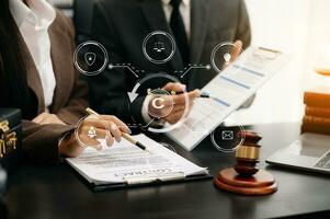 Copyright or patent concept, Business team analyzing data and using smart phone and tablet with virtual screen copyright icon trademark license, Creation ownership against piracy. at office photo
