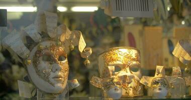 Handmade masks for Venetian carnival in glass shop-window video