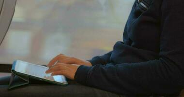 Woman Writing on Tablet PC during the Trip video