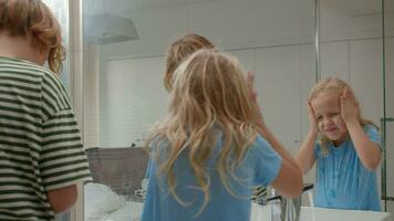 Siblings Washing Face Together in Bathroom video