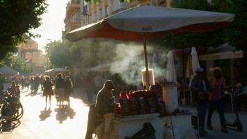 Crowd on sunlit street market video