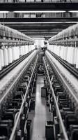 Modern textile factory with automated looms weaving patterns AI Generative photo