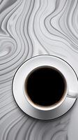 Aerial View of Steaming Coffee Cup on Geometrically Patterned Surface with Ample Copy Space photo