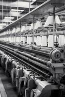 Modern textile factory with automated looms weaving patterns photo