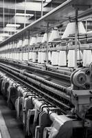 Modern textile factory with automated looms weaving patterns AI Generative photo