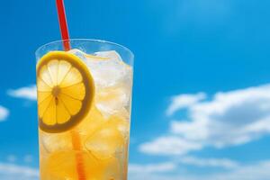 Bright Summer Image of Iced Lemonade in Glass with Lemon Slice and Straw photo