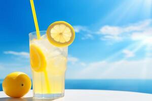 Bright Summer Image of Iced Lemonade in Glass with Lemon Slice and Straw photo