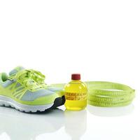 Conceptual health and lifestyle image with running shoes, water bottle, and a heart-shaped measuring tape symbol AI Generative photo