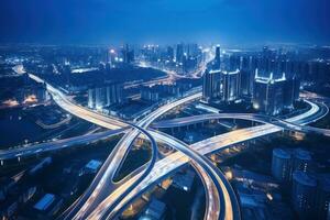 A street at night with vehicles and highways photo