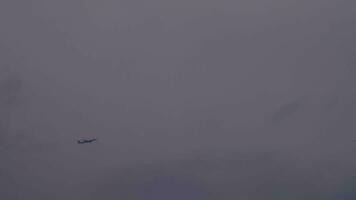 Wide shot of airplane in the fog and clouds video