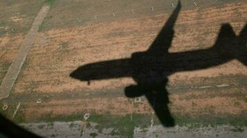 The shadow of airplane is approaching the ground video