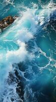 Blue sea wave with white foam photo
