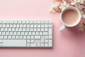 a cup of tea on computer desk photo