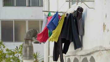 Colorful laundry drying outdoors video