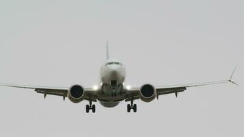 Frontal view of passenger airplane landing video