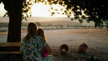 Mother and daughter admiring view in mountains video