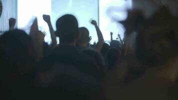 Excited crowd of young fans dancing at the concert video