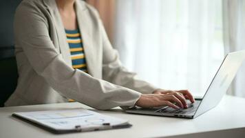 business woman working with digital tablet computer and smart phone with financial business strategy layer effect on desk video