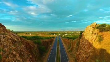 Canyon Like Mountains With a Highway In-between - Upwards video