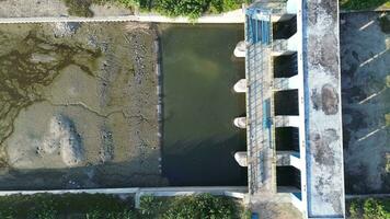 aerial view of the water in a dry dam due to drought video