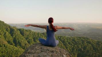 Yoga Session in the Mountains. Young Athletic Woman Exercising in the Rocky Mountains During Sunrise, Doing Various Yoga Poses - Healthy Lifestyle and Zenism Concept. Slow Motion. video