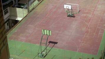 Empty basketball court on the roof, view from the house window video