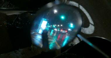 Transport traffic under the night rain, motorbike mirror reflection video