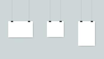 White blank paper poster template hanging on wall. Isolated set of empty sheet in horizontal, vertical and square style. A4 banner template with clips and rope. Vector EPS 10.