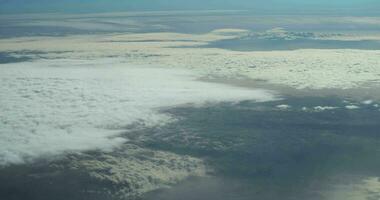 Plane flies over the clouds in the sky video