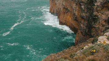 Azure ocean waves crashing rocks of Cape St. Vincent in Portugal video