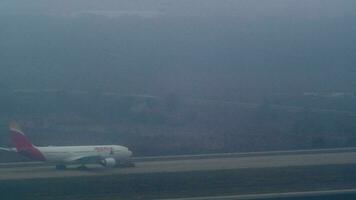 Airplane tug taxiing the aircraft of Iberia, Spanish airline video