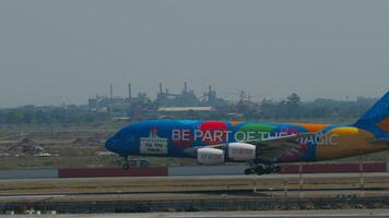 BANGKOK, THAILAND JANUARY 19, 2023 - Airbus A380 of Emirates with livery Be part of the magic landing at Suvarnabhumi airport, side view. Double deck huge board arrival. Tourism travel concept video