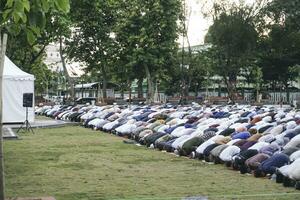 A photo of Muslim congregation praying Eid al-Adha in the field