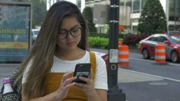 Young Woman Checks Class Schedule and Homework on Mobile Phone video