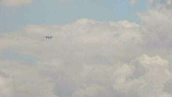 Turboprop plane approaching before landing, long shot. Airplane flies, front view video