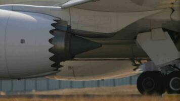 Aircraft engine close up. Airplane on the taxiway, view through the fence. Chassis and turbine video