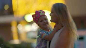 Joyful child having fun with mum and giving her kisses video