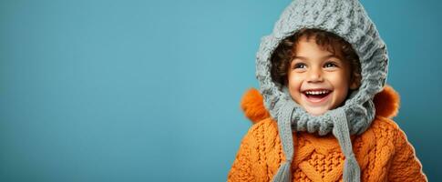 Boy in full knitted cozy costume isolated on vivid background with a place for text photo