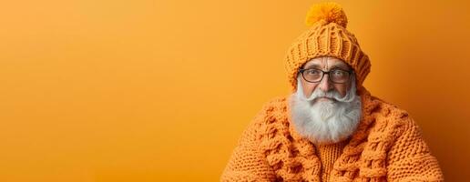 Old man in full knitted cozy costume isolated on vivid background with a place for text photo