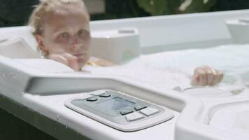 A young woman in jacuzzi video