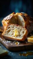 A slice of bread with butter and honey dripping down the side photo