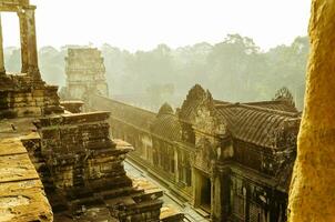 Angkor Wat in the Mist of Morning at Siem Reap Province of Cambodia photo