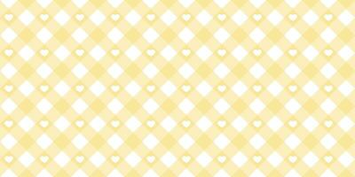 Gingham heart diagonal seamless pattern in yellow pastel color. Vichy plaid design for Easter holiday textile decorative. Vector checkered pattern for fabric - blanket, tablecloth, dress, napkin.